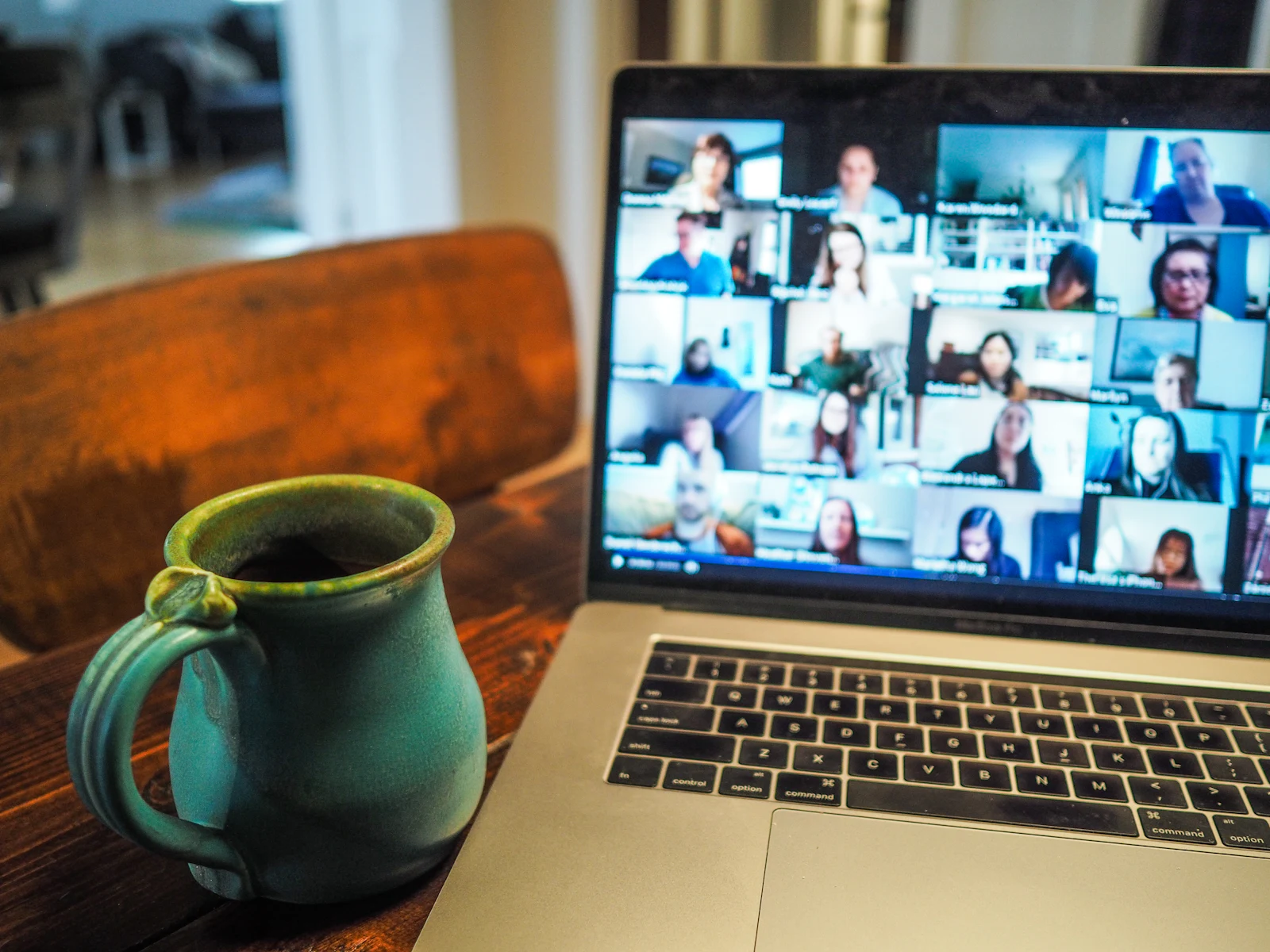 Laptop showing a distributed team in a video meeting